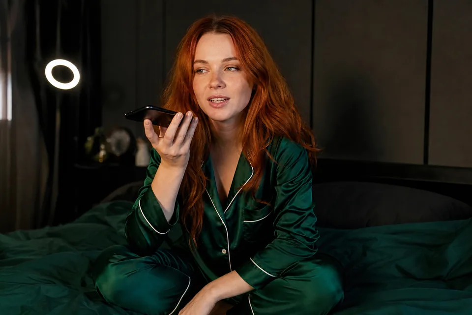 Creator recording a voice note for her subscribers